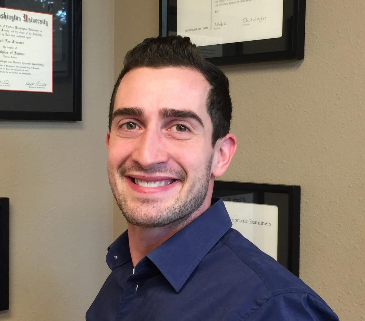 Dr. Scott Freeman smiling in a chiropractic office