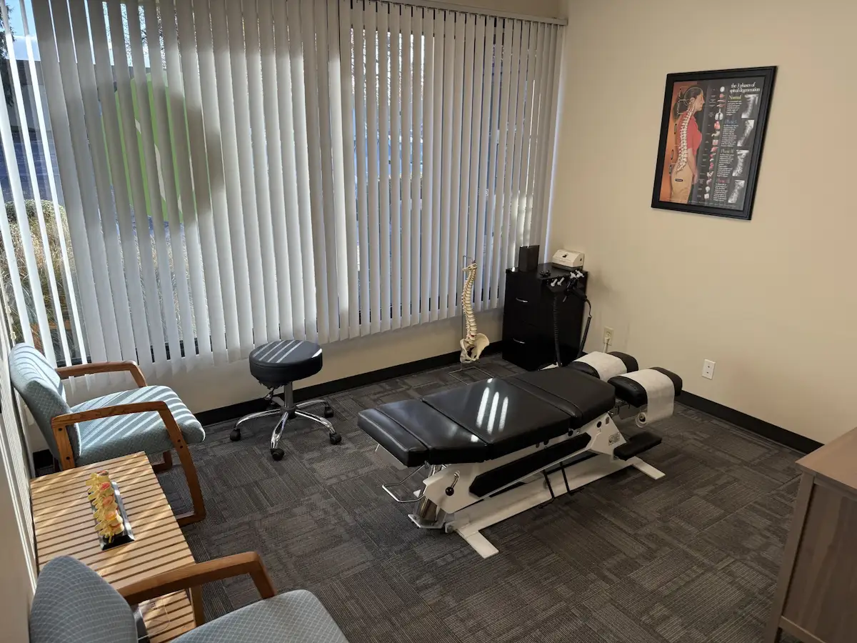 Chiropractic adjustment table in treatment room