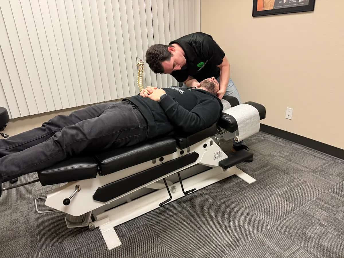 Cervical spine adjustment by chiropractor