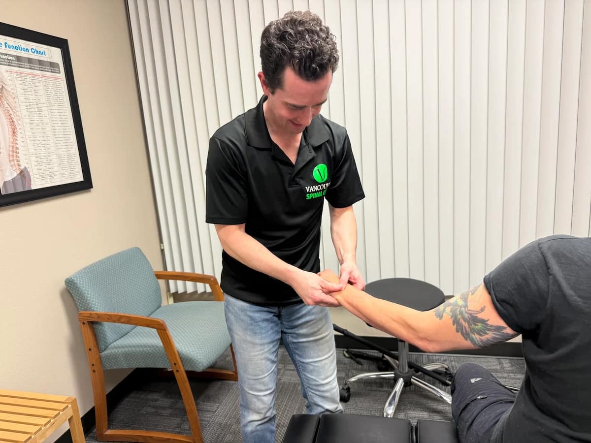 Chiropractor adjusting patient's wrist