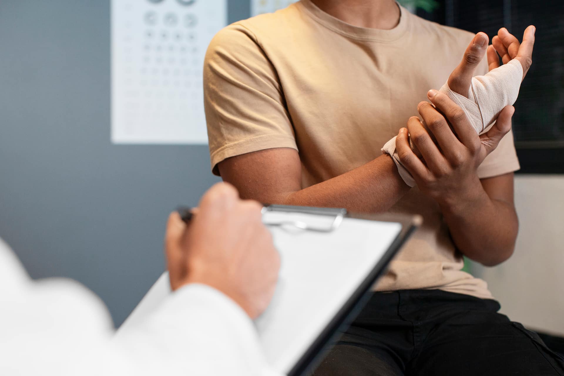 Chiropractor assessing wrist injury