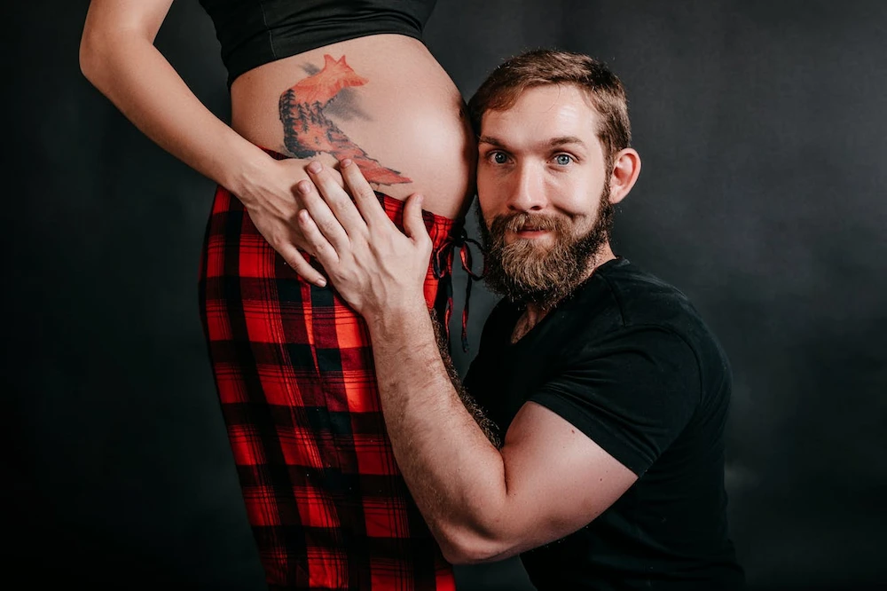 pregnant woman standing with supportive partner