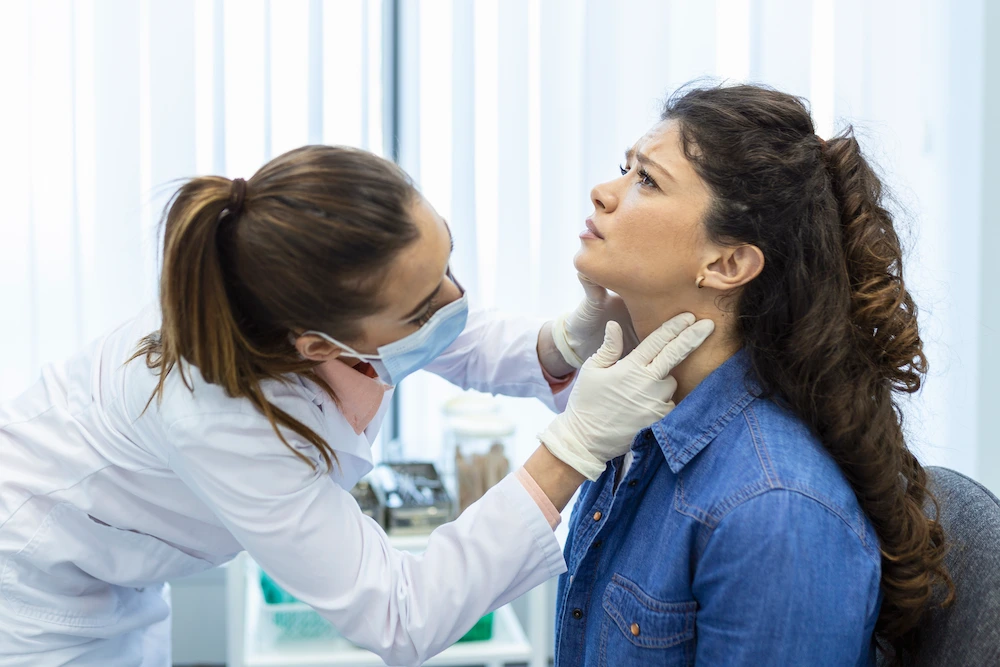 Chiropractor performing upper cervical adjustment on female patient